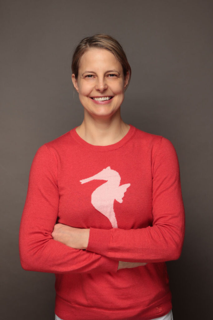 bettina red shirt arms folded bettina red shirt arms folded
