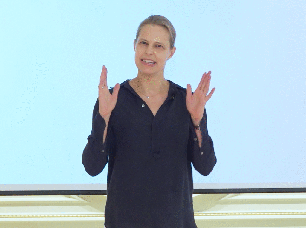 bettina speaker hands upright